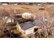 Aerial view of house with barns and outbuildings nestled on a large lot, perfect for hobby farming at 3428 W County Road 4, Berthoud, CO 80513