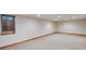 A spacious basement featuring neutral carpeting, wood trim, and recessed lighting at 3428 W County Road 4, Berthoud, CO 80513