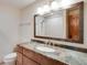 Bathroom featuring granite countertops, a decorative mirror, and a shower in the mirror's reflection at 3428 W County Road 4, Berthoud, CO 80513