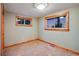 Empty bedroom with wood trim windows and light green walls at 3428 W County Road 4, Berthoud, CO 80513