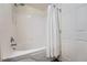 Bathroom with bathtub and shower, and a white curtain at 431 Black Feather Loop # 817, Castle Rock, CO 80104