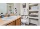 Clean bathroom with single sink vanity, shower, and built-in shelving at 431 Black Feather Loop # 817, Castle Rock, CO 80104