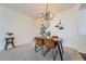 Dining area featuring stylish chandelier and wood table, perfect for entertaining guests and Gathering gatherings at 431 Black Feather Loop # 817, Castle Rock, CO 80104