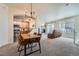 Open-concept living room and dining area with a view of the kitchen featuring stainless steel appliances at 431 Black Feather Loop # 817, Castle Rock, CO 80104