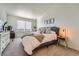 Comfortable main bedroom with a desk workspace and large window at 431 Black Feather Loop # 817, Castle Rock, CO 80104