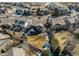 Aerial view of homes in suburban neighborhood with brown roof and trees at 11043 Valleybrook Cir, Highlands Ranch, CO 80130