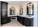 Elegant bathroom features dual vanities with marble countertops and stylish black fixtures, plus a makeup area at 11043 Valleybrook Cir, Highlands Ranch, CO 80130