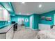 Basement bedroom with teal walls, carpet, dresser, built-in desk, and window with blinds at 11043 Valleybrook Cir, Highlands Ranch, CO 80130