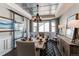 Dining room with decorative ceiling, modern light fixture, and glass doors at 11043 Valleybrook Cir, Highlands Ranch, CO 80130