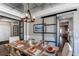 Beautiful dining room featuring a wood table, metal ceiling and sliding glass doors at 11043 Valleybrook Cir, Highlands Ranch, CO 80130