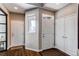 Bright foyer featuring a large double-door closet, beautiful hardwood floors, and a window providing ample natural light at 11043 Valleybrook Cir, Highlands Ranch, CO 80130