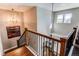 Upstairs view of the modern staircase featuring dark hardwood steps, iron railings, and stylish lighting at 11043 Valleybrook Cir, Highlands Ranch, CO 80130