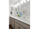 Bathroom featuring double sinks with gray cabinetry and modern fixtures and decor at 43124 Kawana Gulch St, Elizabeth, CO 80107