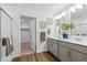 Modern bathroom with double vanity, walk-in shower and open doorway to walk-in closet at 43124 Kawana Gulch St, Elizabeth, CO 80107