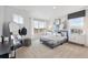 Comfortable bedroom featuring plush carpet, neutral walls, and a large window at 43124 Kawana Gulch St, Elizabeth, CO 80107