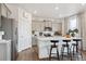 Modern kitchen featuring stainless steel appliances, a large center island with bar seating at 43124 Kawana Gulch St, Elizabeth, CO 80107