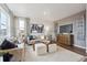 Comfortable living room with neutral tones, plush seating, and a large window, creating a relaxing atmosphere at 43124 Kawana Gulch St, Elizabeth, CO 80107