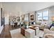 Open-concept living space with a modern kitchen, dining area, and comfortable living room, ideal for Gathering gatherings at 43124 Kawana Gulch St, Elizabeth, CO 80107