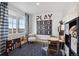 Inviting playroom featuring a tic-tac-toe game, cozy seating, and natural light, perfect for activities at 43124 Kawana Gulch St, Elizabeth, CO 80107
