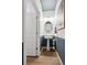 Stylish powder room with a pedestal sink, wainscoting, and modern fixtures for a sophisticated touch at 43124 Kawana Gulch St, Elizabeth, CO 80107