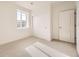 Bright bedroom featuring a window, carpet, and closet at 1821 Grayside Cir, Castle Rock, CO 80109