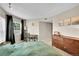 Comfortable bedroom features neutral walls, a desk near the window, and carpet floors at 1226 S Monaco Pkwy # 308, Denver, CO 80224