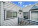 Charming condo entrance with a welcoming door, unit number, and fresh blue and white exterior at 1226 S Monaco Pkwy # 308, Denver, CO 80224
