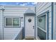 Charming condo entrance with a welcoming door, unit number, and fresh blue and white exterior at 1226 S Monaco Pkwy # 308, Denver, CO 80224