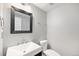 Clean half bathroom with modern vanity and contemporary mirror at 2238 S Nile Ct, Aurora, CO 80014