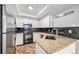 Modern kitchen featuring stainless steel appliances and granite countertops at 2238 S Nile Ct, Aurora, CO 80014