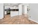 Open kitchen with tile floors, black appliances, and granite countertops at 2238 S Nile Ct, Aurora, CO 80014