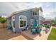 Backyard featuring a deck, seating area, lawn, and well-maintained landscaping at 2295 Sandhurst Dr, Castle Rock, CO 80104