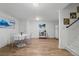 Basement with laminate flooring, table, refrigerator, microwave, and decor at 2295 Sandhurst Dr, Castle Rock, CO 80104