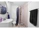 Bathroom with tile shower, modern sink, and decorative mirror at 2295 Sandhurst Dr, Castle Rock, CO 80104