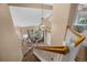 Bright foyer with hardwood floors, staircase, and natural light flowing into the living area at 2295 Sandhurst Dr, Castle Rock, CO 80104