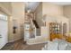 Open-concept foyer showcasing a staircase, hardwood floors, and elegant decor at 2295 Sandhurst Dr, Castle Rock, CO 80104