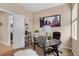 Another view of the bright home office with modern desk, neutral walls, and a bookshelf at 2295 Sandhurst Dr, Castle Rock, CO 80104