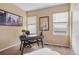 Bright home office with modern desk, neutral walls, and natural light from the windows at 2295 Sandhurst Dr, Castle Rock, CO 80104