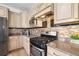 Well-equipped kitchen with stainless steel appliances, granite countertops, and mosaic backsplash at 2295 Sandhurst Dr, Castle Rock, CO 80104