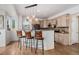 Open kitchen with granite countertops, stainless steel appliances, pendant lights, and barstool seating at 2295 Sandhurst Dr, Castle Rock, CO 80104