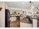 Well-equipped kitchen with stainless steel appliances, granite countertops, and modern lighting at 2295 Sandhurst Dr, Castle Rock, CO 80104