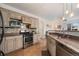 Well-equipped kitchen with stainless steel appliances, custom cabinets, and a tiled backsplash for a modern touch at 2295 Sandhurst Dr, Castle Rock, CO 80104