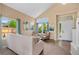 Bright living room with large windows, stylish furniture, and neutral decor at 2295 Sandhurst Dr, Castle Rock, CO 80104