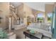 Spacious living area flows into dining space, with a staircase and backyard access at 2295 Sandhurst Dr, Castle Rock, CO 80104