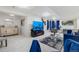 Open living room with plush seating, modern decor, and a large flat-screen TV for entertainment at 2295 Sandhurst Dr, Castle Rock, CO 80104