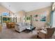 Open living space with high ceilings, large windows, and a dining area for entertaining at 2295 Sandhurst Dr, Castle Rock, CO 80104