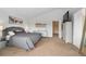 Bright main bedroom with white walls, vaulted ceiling, carpet flooring, and decor at 2295 Sandhurst Dr, Castle Rock, CO 80104
