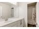 Elegant bathroom with a large vanity and a shower/tub combination at 5840 Longs Peak St, Brighton, CO 80601