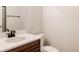 Bathroom featuring a modern vanity, sink, and updated hardware at 5840 Longs Peak St, Brighton, CO 80601
