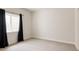Neutral bedroom features a bright window and offers a peaceful retreat at 5840 Longs Peak St, Brighton, CO 80601
